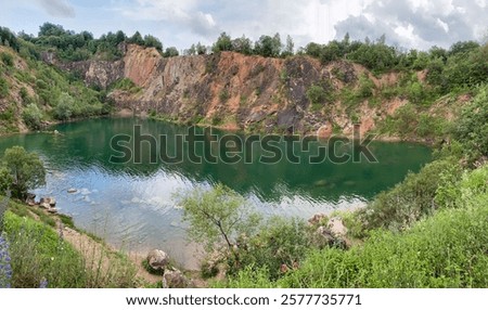 Lake Beňatina is a former flooded quarry located in Slovakia in the cadastre of the village of Beňatina, district of Sobrance.