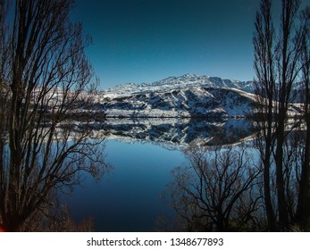 Lake Hayes, New Zealand. Snowy Mountian, Reflections.