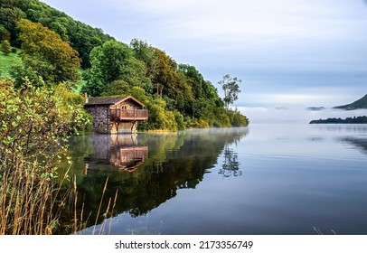 Lake House On The Shore Of The Forest. Lake House View. Landscape Of Lake House. Lake House In The Morning Fog