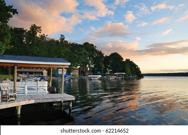 Lake House With Pier And Woods With Sunrise In The Morning In New York State Finger Lakes