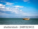 Lake Kinneret, also known as the Sea of Galilee, in Israel. A serene freshwater lake surrounded by hills and rich in historical and religious significance.