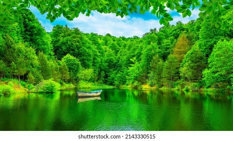 Lake landscape in the forest. Lake view in spring. Nature landscape in green lake. boat on the lake in the forest.  nature scenery background theme. Uludag mountain national park, Bursa, Turkey. - Shutterstock ID 2143330515