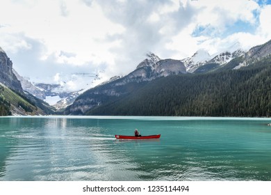 LAKE LOUISE, AB, CANADA - JUNE 2018: Person paddling a canoe on Lake Louise in Alberta, Canada. - Shutterstock ID 1235114494