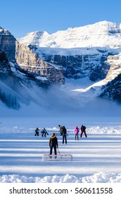 Lake Louise, January 25, 2014 - Family & Friends Play A Game Of Hockey On The Ice Amongst The Canadian Rocky Mountains At Lake Louise, Alberta, Canada