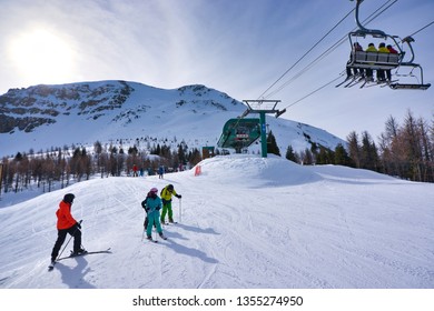 Lake Louise Ski Resort. Banff. Alberta. Canada. March 23 2019.  Many Took Advantage Of The Warmer Weather In Spring To Ski At The Lake Louise Resort.  The Lift Chairs Were Full Of People.