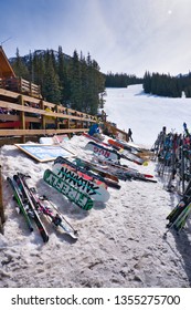 Lake Louise Ski Resort. Banff. Alberta. Canada. March 23 2019. The Ski Lodge Was Full Of People, Judging From The Snowboards And Skis Outside The Lodge.