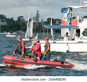 Lake Macquarie, Australia - April 16, 2013: Starting Line Personell And Vessels At The Australian High School Championships On Belmont Bay.