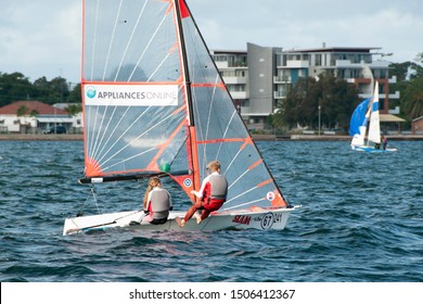 Lake Macquarie, Australia - April 16, 2013: Children sailing under supervision competing in the Australian High School Championships on Belmont Bay.