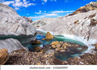 lake and melting snow on high altitude of K2 trekking route Pakistan