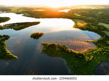 Lake in morning sunrise. Rural landscape. Lake Countryside at dawn in fog, drone view. Lake in Foggy dawn. Freshwater ecosystems. Drink water safe. Global drought crisis. Aerial panoramic landscape. - Shutterstock ID 2194465053
