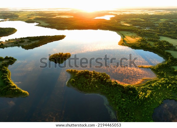 Lake in morning sunrise. Rural landscape. Lake\
Countryside at dawn in fog, drone view. Lake in Foggy dawn.\
Freshwater ecosystems. Drink water safe. Global drought crisis.\
Aerial panoramic\
landscape.