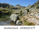 Lake Mort dominated by mountains in the Lake St. Maurice Pyrenees National Park