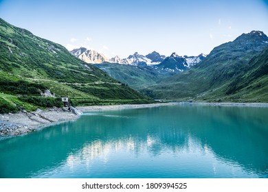 Lake In Mountains. Austrian Alps Travel Background