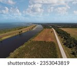 Lake Okeechobee scenic trail , canal and country road . Aerial view.