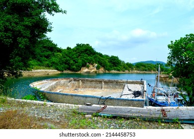 Lake And Old Small Boat