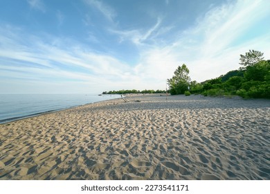 Lake Ontario in Canada. Beautiful magic wide view of sand and waves near lake water shore. Quiet peaceful and serene meditation spot.  - Shutterstock ID 2273541171