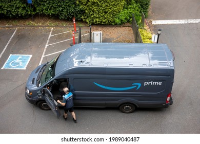 Lake Oswego, OR, USA - May 20, 2021: An Amazon Delivery Driver And His Van Are Seen In A Neighborhood Parking Lot In Lake Oswego, Oregon.