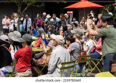 Lake Oswego, OR, USA - May 22, 2022: Viewers Take Photos And Videos At The Asian American And Pacific Islander Heritage Month Celebration Held In Millennium Plaza Park In Lake Oswego, Oregon.