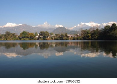 Lake Phewa in Pokhara, Nepal, with the Himalayan mountains in the background, including Machhapuchhre and Annapurna II and IV