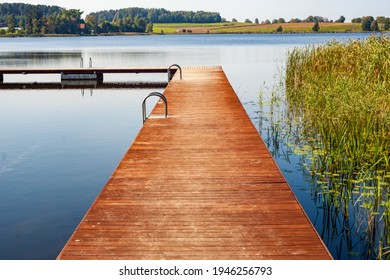 Lake Pier On A Sunny Summer Day