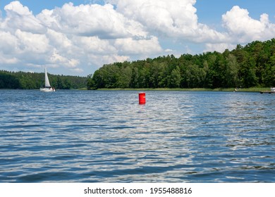 Lake In Polish Masuria, Sailing Yachts On A Sunny Day. Picturesque Sky, Masuria, Poland