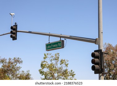 The Lake Poway Rd Sign Hanging Off The Traffic Light Post.