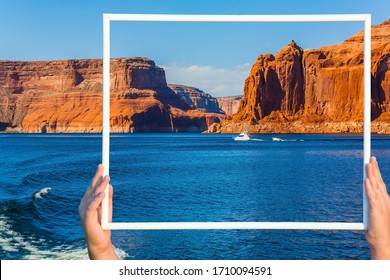  Lake Powell is a reservoir on the Colorado River, USA. Excursion on a pleasure boat on Lake Powell. Picturesque lake with blue water, among rocks of red sandstone. Concept of active and photo tourism
