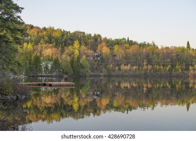 Lake Reflection With Spring Color. Laurentides, Quebec Canada