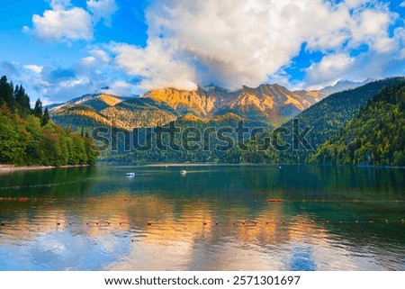 Lake Ritsa panoramic view at sunset. Lake Ritsa is a lake in the Caucasus Mountains in Abkhazia region, Georgia.