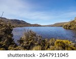 Lake Rodway situated near Scott Kilvert Memorial Hut on a warm autumn morning in Cradle Mountain, Tasmania, Australia