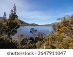 Lake Rodway situated near Scott Kilvert Memorial Hut on a warm autumn morning in Cradle Mountain, Tasmania, Australia