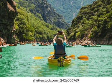 Lake of Sainte Croix du Verdon in the Verdon Natural Regional Park, France with kayaks and boats, canoe adventure sports activity.

 - Powered by Shutterstock