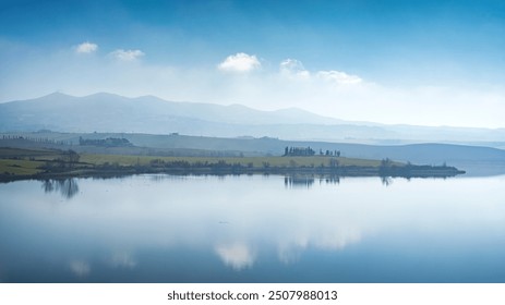 Lake Santa Luce view in a blue misty morning. Colline Pisane,Tuscany region, Italy - Powered by Shutterstock