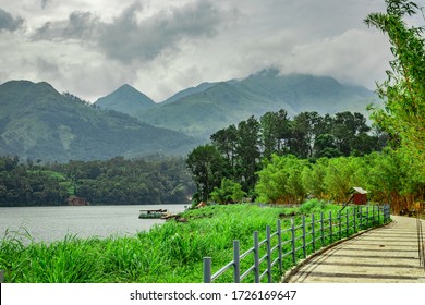lake serene with beautiful hiking trails and mountain background image is taken at banasura sagar dam wayanad kerala india. the natural beauty of this place is amazing.
