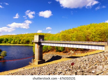 The Lake Side Of Hop Brook Dam In Naugatuck Connecticut On A Sunny Blue Sky Day.