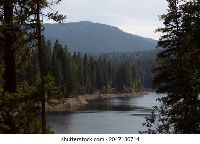 Lake Siskiyou Surrounded By The Shasta-Trinity National Forest With The Trinity Mountains In The Distance Near Mt. Shasta, California.