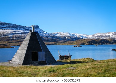 Lake with snow covered mountains and triangular  shack for  firepit and warmth in cold weather  in the Telemark region Norway, Scandinavia - Powered by Shutterstock