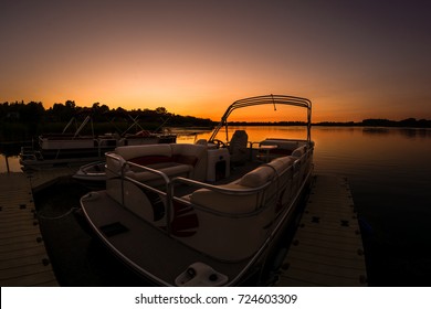 Lake Sunset Featuring Docked Pontoon Boat