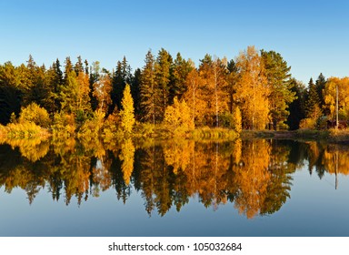 Lake In Sunset Rays. Fall Landscape.