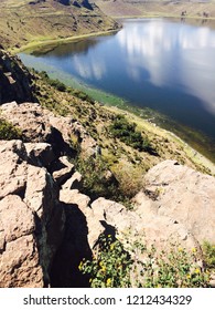 Lake surrounded by cliffs
