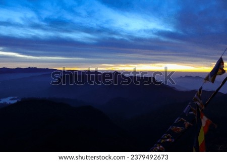 The lake surrounded by the morning mist at the Little Adam's Peak, Sri Lanka. Sunrise sky with copy space for text