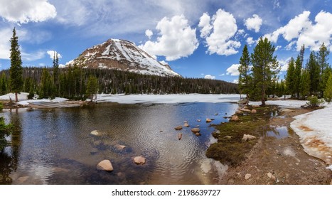 Lake Surrounded By Mountains And Trees In Amercian Landscape. Spring Season. Mirror Lake. Hanna, Utah. United States. Nature Background Panorama