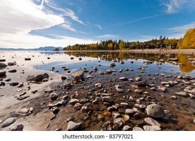 Lake Tahoe In Fall With Reflections Of Trees And The Sky