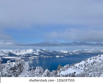 Lake Tahoe, Heavenly Ski Resort, Skiing, Snowboarding, Activity All Over. Border Of California And Nevada. Snowy Mountains And Lake Tahoe, Trees Covered With Snow On The Mountain.