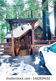 LAKE TAHOE, NV - NOVEMBER 25, 2018: Wooden Entrance Front With House In Background And White Car On The Side