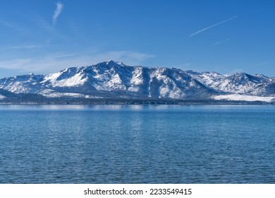 Lake Tahoe and Snow Covered Desolation Wilderness Peaks from Nevada Beach 