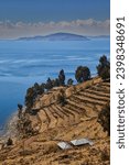 Lake Titicaca is a large, deep lake in the Andes on the border between Bolivia and Peru. It is situated at an elevation of approximately 3,812 meters (12,507 feet) above sea level.