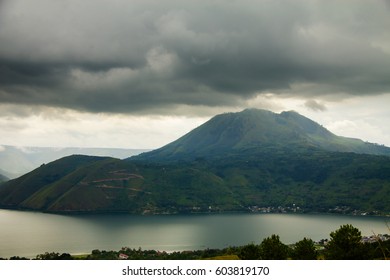 Lake Toba (Danau Toba) And Volcano Under Heavy Clouds, North Sumatra, Indonesia