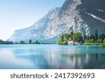 Lake Toblino or Tobliner See, Castel Toblino and reflection of the mountain. Madruzzo, province of Trento, Trentino Alto Adige region, Italy, Europe.