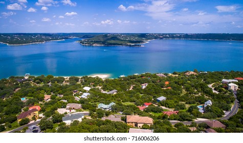 Lake Travis mansions and homes along the lake aerial drone view curvy road to the lake house Outside Austin Texas